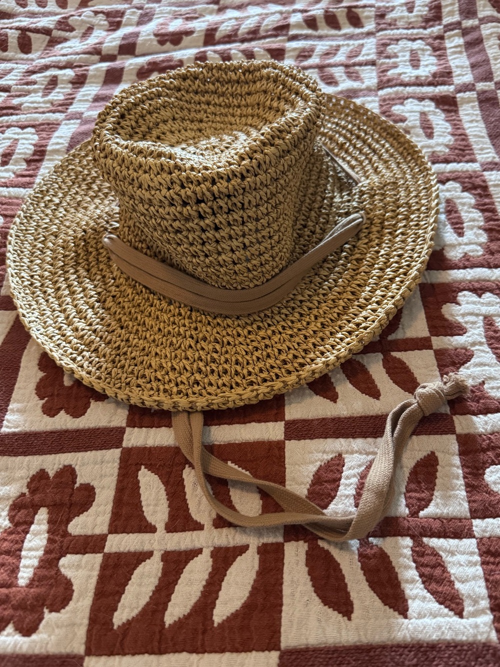 Zara woven hat with adjustable cord.